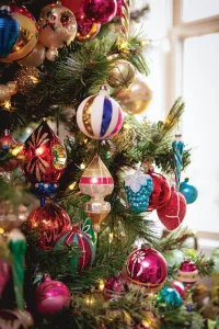 vintage and antique ornaments on Christmas tree in modern collected farmhouse