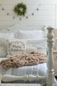 bedroom with shiplap, natural wreath and silver bell garland in modern collected farmhouse