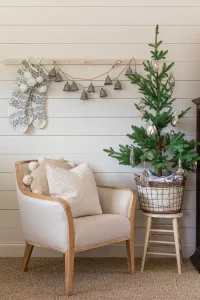 bell garland and tree in vintage egg basket in modern collected farmhouse