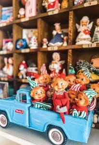 vintage blue toy truck filled with elf dolls