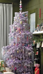 lavender colored artificial tree decorated in vintage tinsel and vintage Soviet and Polish glass ornaments
