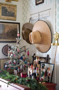 nutcracker collection alongside mini tree with glass and nutcracker ornaments