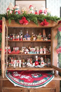 hutch filled with vintage holiday figurines