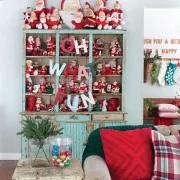 Santa collection in flea market hutch with patina turquoise paint