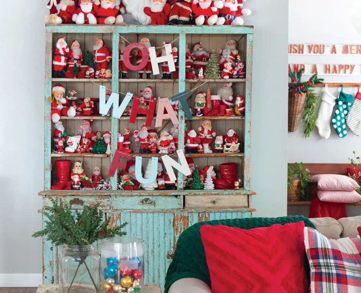 Santa collection in flea market hutch with patina turquoise paint