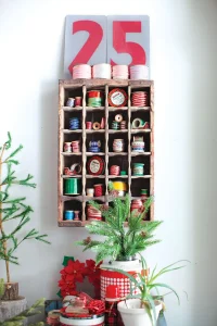 countdown to Christmas and spools of ribbon and thread in organizer
