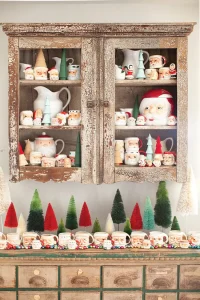 collection of vintage Santa mugs accented with bottlebrush trees for Christmas with a dash of retro style