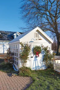 outdoor greenhouse with natural Christmas wreath