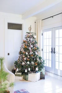 Christmas tree in neutral color scheme with white and brown woodland creatures