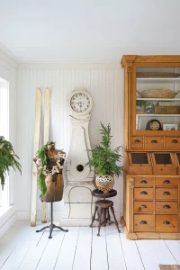 Mora clock, vintage skis and vintage manniquen wearing holiday garland
