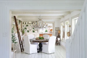 white dining room with festive greenery