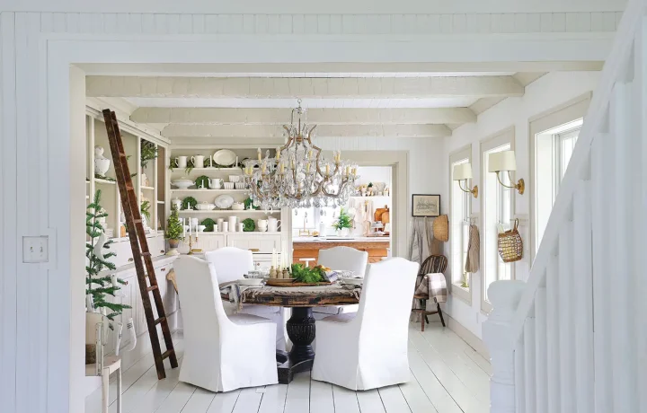 white dining room with festive greenery