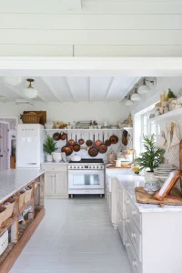 neutral kitchen with potted mini trees for neutral serene holiday decor