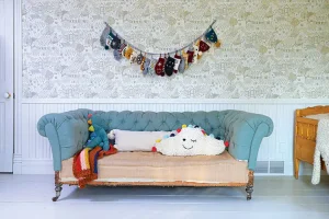 vintage sofa with garland of knit kids socks above