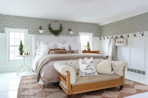 master bedroom in neutral color scheme with natural wreath