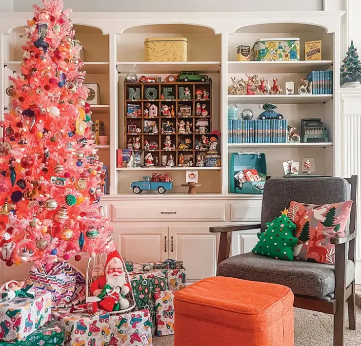 bright notes of nostalgia with pink faux tree, colorful wrapping paper and toy cars