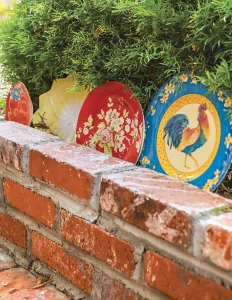 upcycling vintage plates and serveware as garden decor