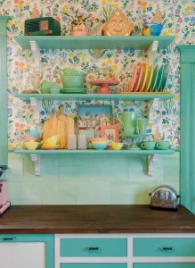 exposed shelves with Jadeite collection and other vintage collectibles in 1915 bungalow kitchen