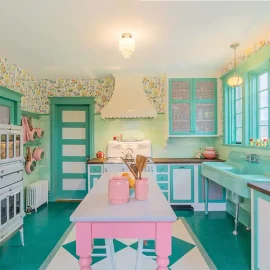 kitchen with scalloped oven hood and vintage inspired pink and mint green color scheme