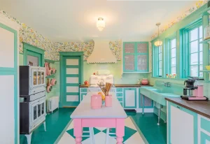 kitchen with scalloped oven hood and vintage inspired pink and mint green color scheme