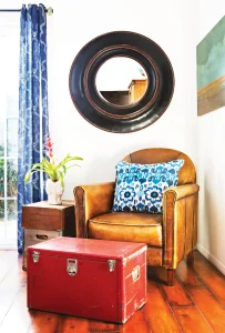vintage trunk upcycled as ottoman that doubles as storage