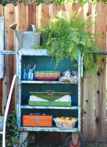 rolling cart upcycled as outdoor dining cart with plates and napkins