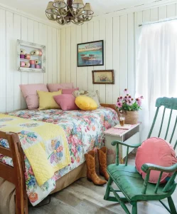 colorful quilts and pillows in cottage by the bay