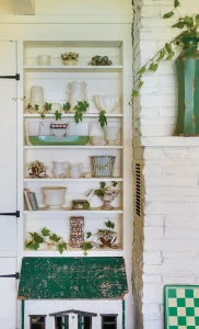 flea market collectibles on shelf in cottage by the bay